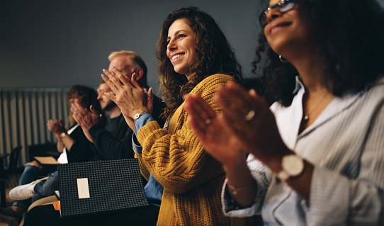 Professionals applauding at an event